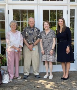 President Dewey Guyton, Vice President and Treasurer Joan Guyton, and Board Member Shelia Bishop of the Lutz Foundation with Hospice and Community Care CEO Jennifer Graham standing together at Hospice and Community Care campus.