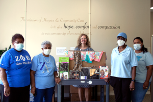 Members of Zeta Amicae of Rock Hill drop off their donation of wigs and scarves to Jenifer Crawford.